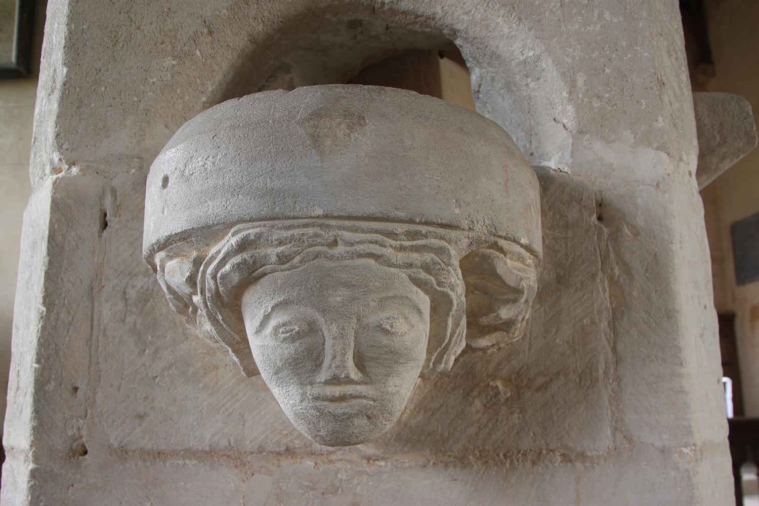 A carved stone head inside a Lincolnshire church