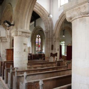 Stone arches and wooden pews inside a Lincolnshire church